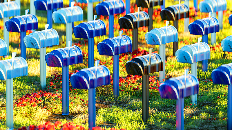 Rows of mailboxes in various blue hues to represent email inboxes