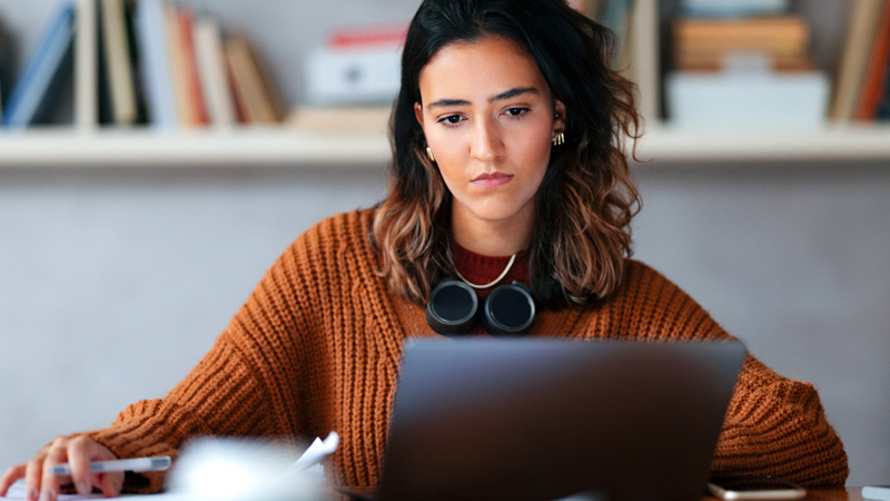 A female disengaged employee powering through the work