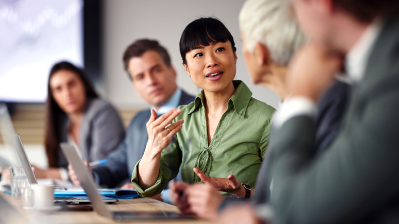 Executives discussion employee retention, led by an Asian, female CEO