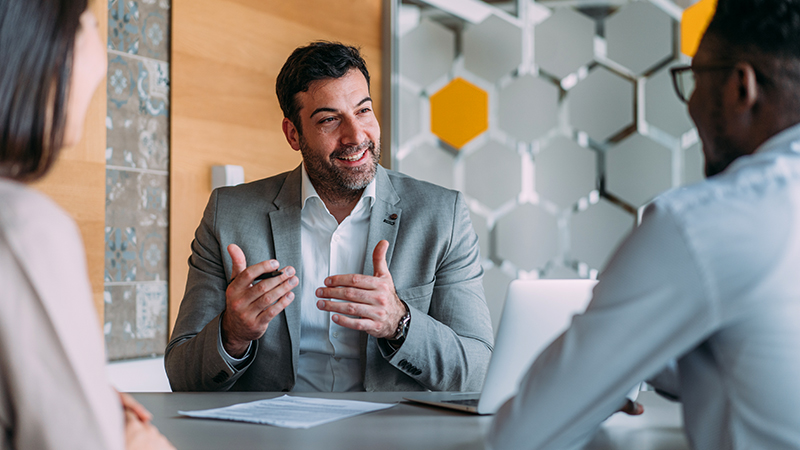 A manager resolving a conflict between two team members using motivational data that depersonalizes the friction